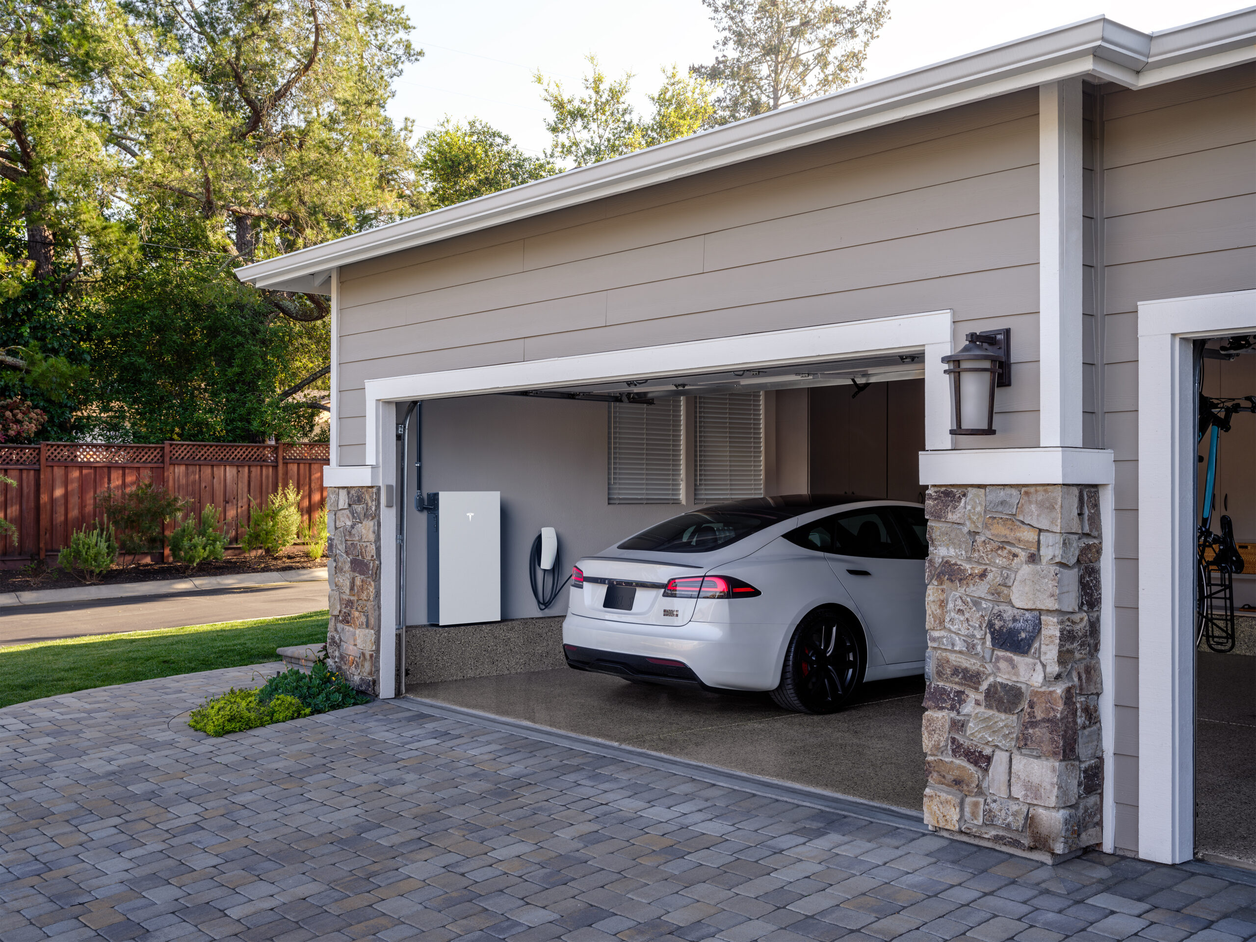 A Tesla Powerwall installed within a garage